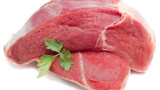 Raw cuts of beef on a white background