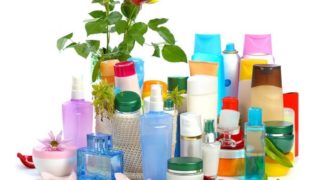 Tubes and bottles of unlabelled cosmetics or skincare products on a white background.