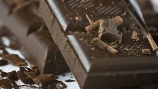 A bar of dark chocolate with chocolate bits