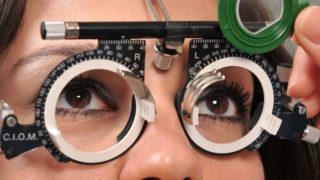 A woman getting her eyesight examined