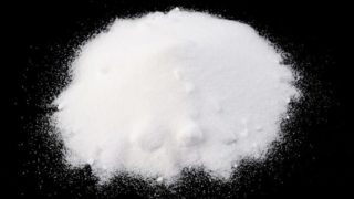 Baking soda on a black canvas