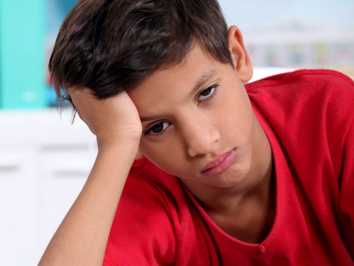 A pensive-looking boy