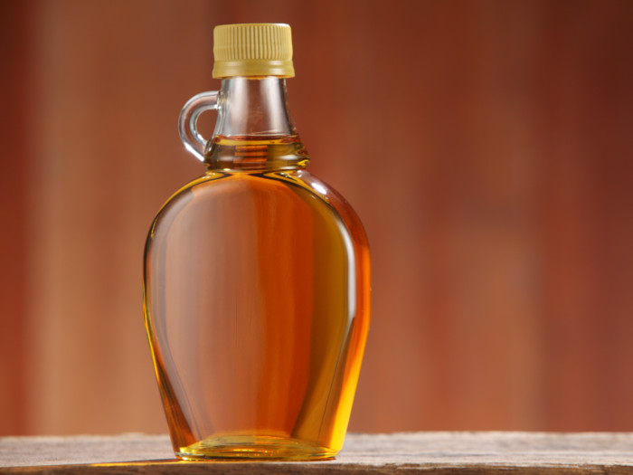 A bottle of honey, maple syrup, or agave nectar