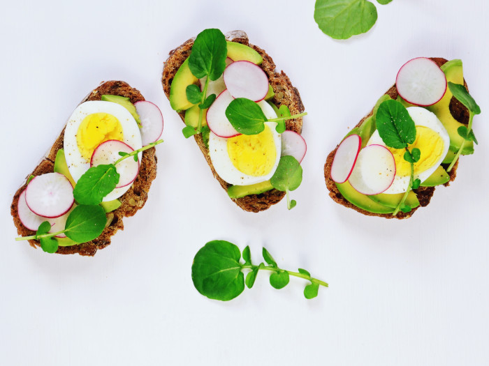 Three slices of avocado and egg toast