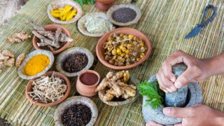 An assorment of ayurvedic herbs on a table
