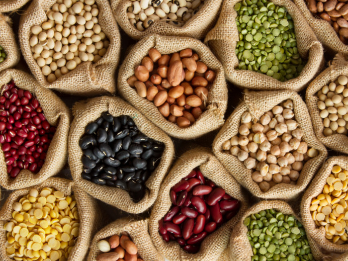 An assorment of different types of beans on a table