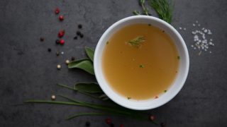 Beef broth or beef tea in small bowl