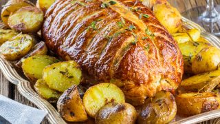 Beef Wellington on a rustic wooden table
