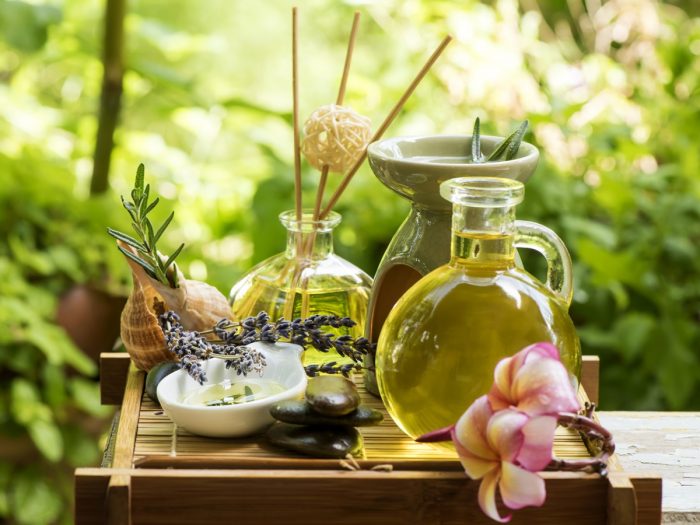 Lavender and rosemary oil bottles in a spa setting