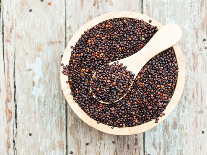 A flat lay picture of a bowl containing black quinoa