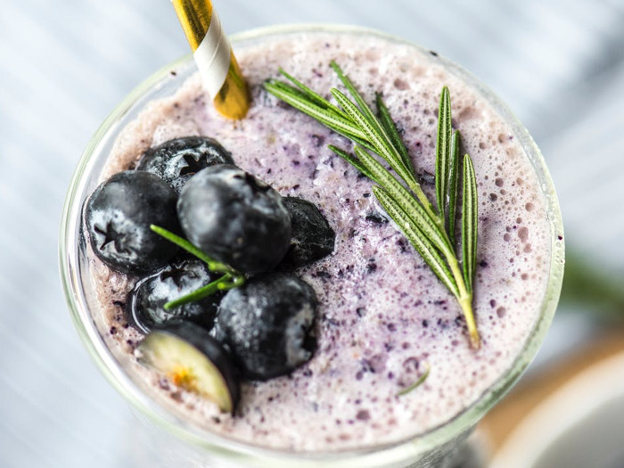 A flat lay close-up shot of blueberry juice