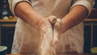 Hands covered in flour