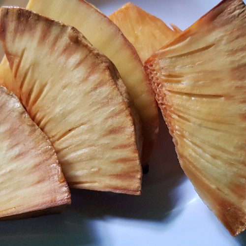 Roasted breadfruit on a blue dish