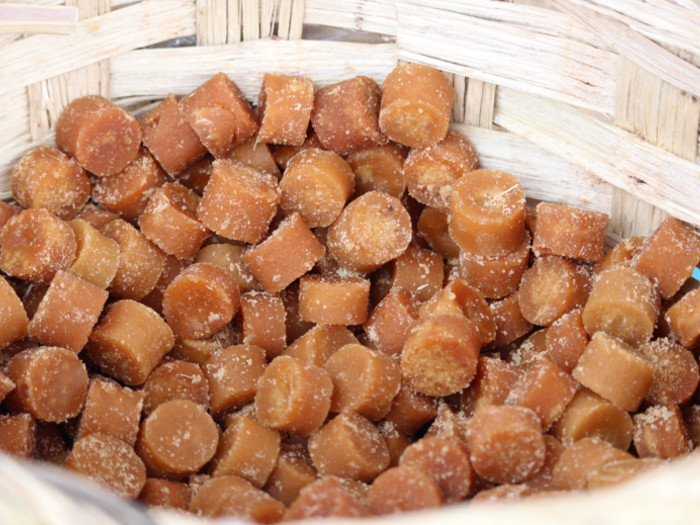 Brown sugar cubes in a basket.