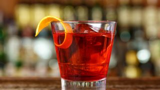 A close up picture of a glass of Campari