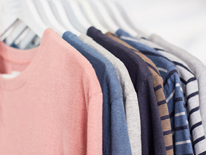 Organic cotton sweatshirts on hangars