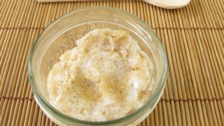 A bowl containing coconut oil sugar scrub