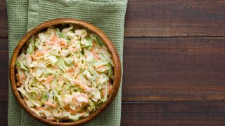 Coleslaw made of freshly shredded white cabbage and grated carrot with homemade mayonnaise-based salad dressing