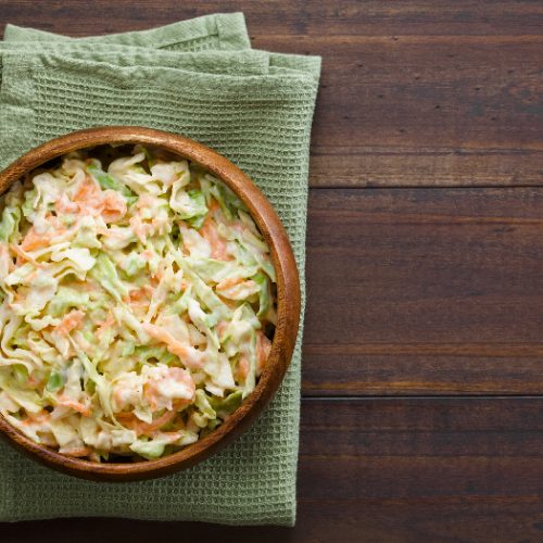 Coleslaw made of freshly shredded white cabbage and grated carrot with homemade mayonnaise-based salad dressing