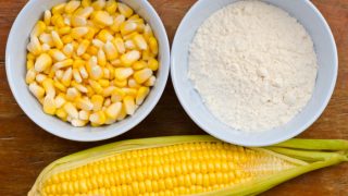 Whole corn, corn kernels, and cornflour in a bowl