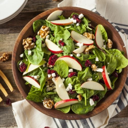 apple cranberry walnut salad in a wooden bowl