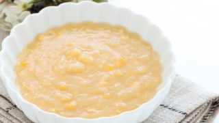 A close-up shot of a bowl containing cream corn