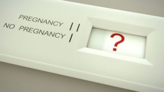 A graphic displaying a pregnancy test