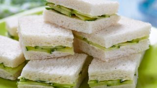 Cucumber sandwiches on a green plate
