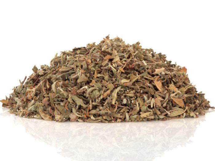 Dried damiana tea leaves on a white background