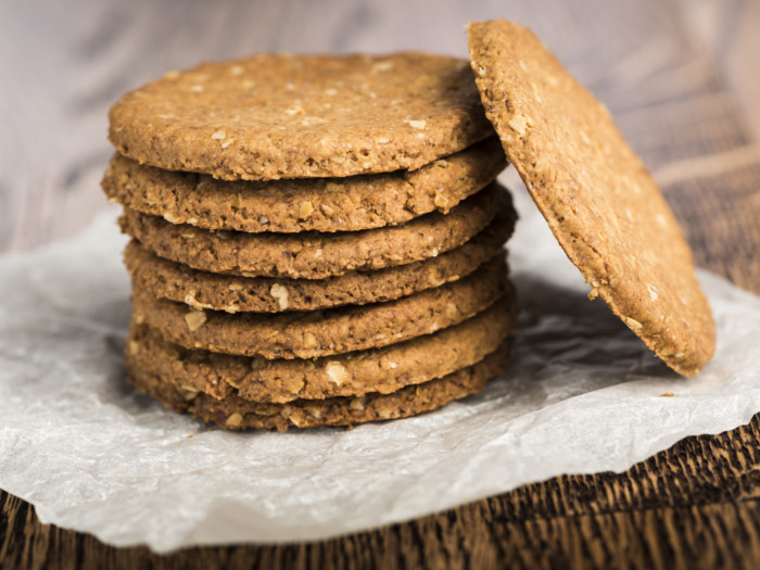 A stack on digestive biscuits on a counter