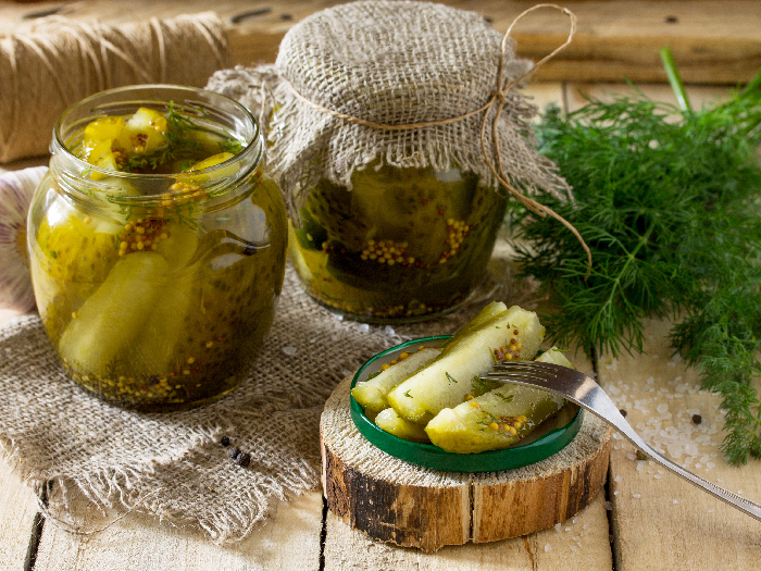 Marinated pickle with cucumber, dill, and garlic on the kitchen table