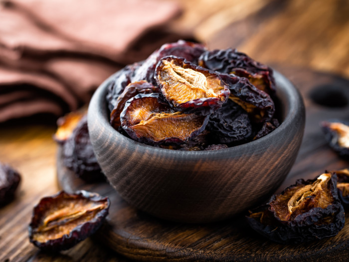 Dried plums in a bowl
