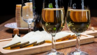 Sherry in wine glasses with a platter of manchego cheese