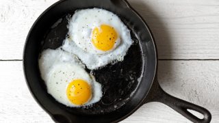 Two egg yolks in a saucepan