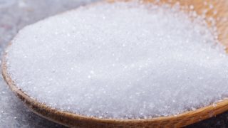 Erythritol on a wooden spoon