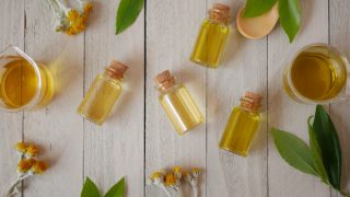 Essential oils for acne on a wooden table