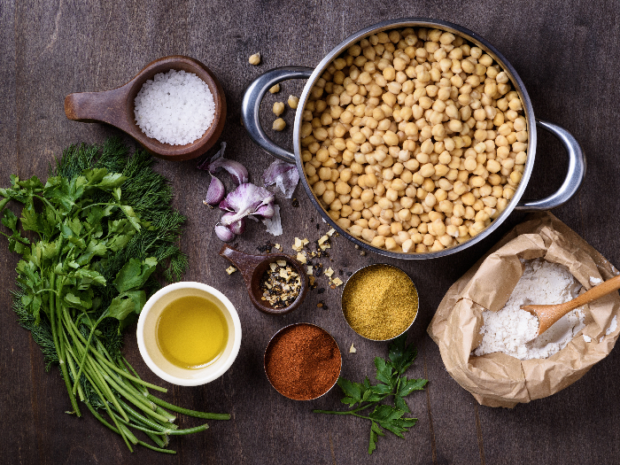 Chickpea in a pan with ingredients for cooking falafel, vegetarian healthy dieting.