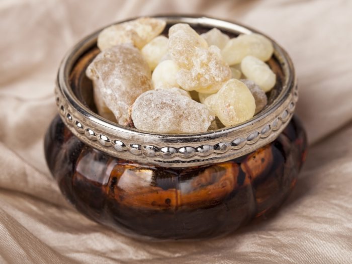 A close-up shot of a bowl containing frankincense