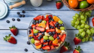 A flat lay picture of a bowl carrying fruit salad