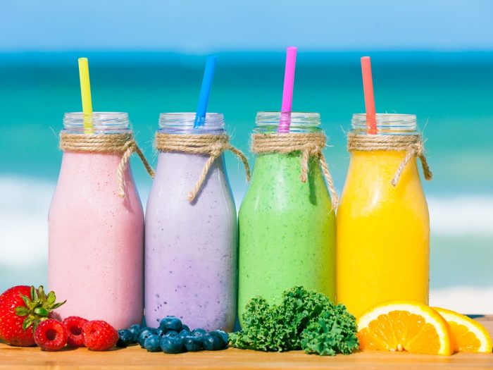 A picture of different kinds of fruit smoothies