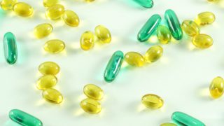 Gel capsules scattered on a white surface