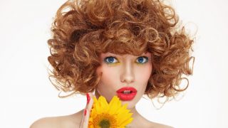 Girl with good hair and a sunflower