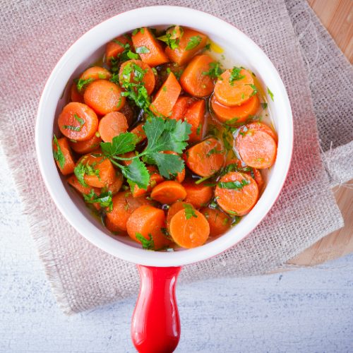 Baby carrots cooked with garlic, honey and parsley