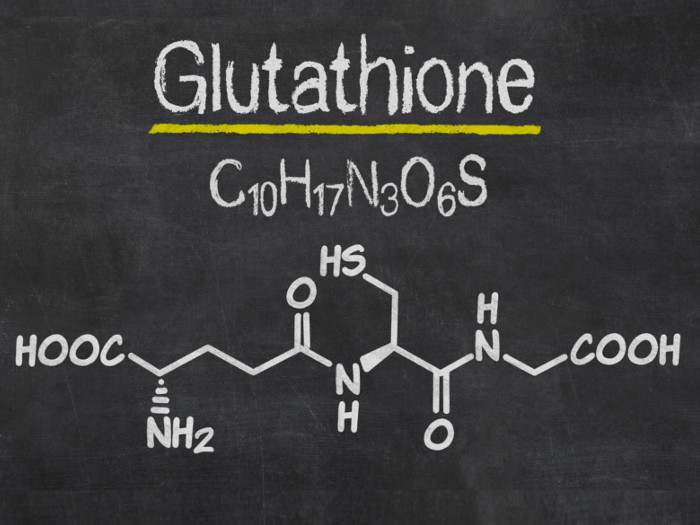 A chemical formula of glutathione on a slate background