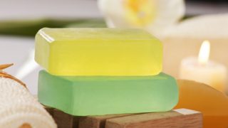 Yellow and green glycerin soaps kept one on top of the other