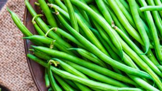 Green beans stacked in a basket