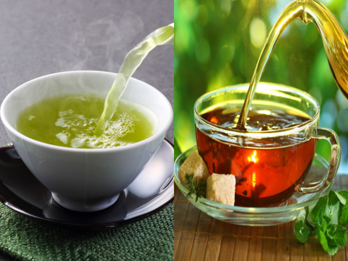 A cup of green tea alongside a cup of black tea