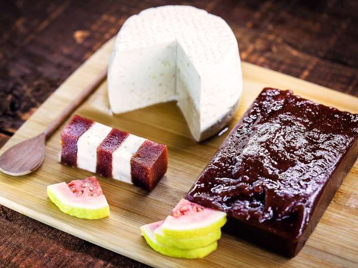 Guava paste, cheese and guava slices on a wooden platter