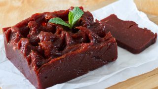 Brazilian dessert goiabada with fresh mint on cooking paper