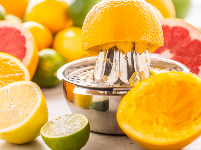 A hand juicer used to squeeze the juice out of sweet lime